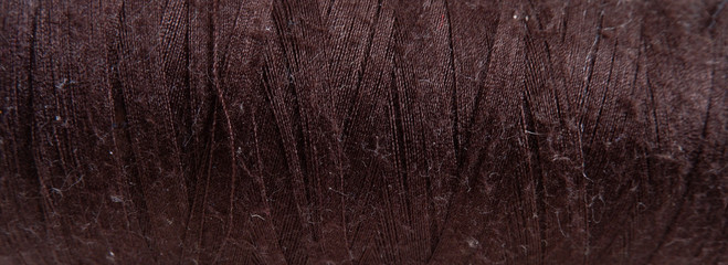Sewing accessories. The texture of brown thread. Suitable for advertising background