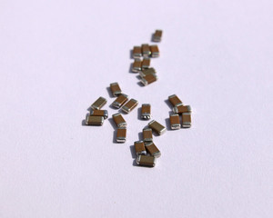 SMD capacitors on white background. Electronic components.