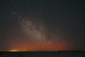 Real Night Sky Stars Background With Natural Colourful Sky Gradient. Sunset, Sunrise Light And Starry Sky. Yellow And Black Colors Over Horizon