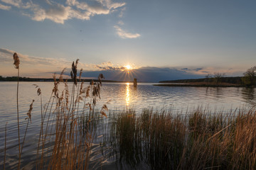 charming landscape on the river at sunset and night time