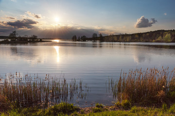 charming landscape on the river at sunset and night time