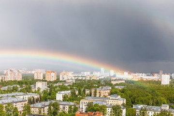 rainbow after rain against a blue sky in Korolev, Moscow region, Russia