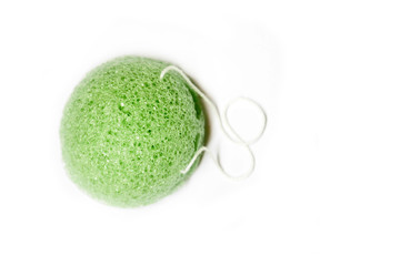 Natural konjac sponge on a white background, top view. Sponge konjac for face and body care