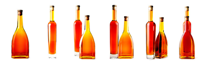 several bottles of brandy whiskey isolated on a white background