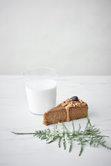 Peanut butter cake with milk in glass