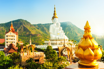 Naklejka premium Amazing Thailand Temple with big Buddha statue on background scenery nature landscape at sunrise. Beautiful Landmark of Asia, Asian culture and religion.