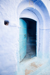 Chefchouen Moroccan blue door in city in the mountains 