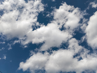 Blue summer sky white cumulus clouds background
