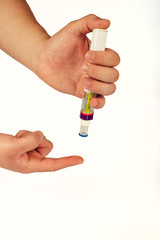 hand holding a syringe