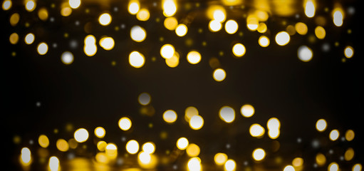 Lights in bokeh background. Yellow and gold lights in bokeh on a black dark background. Holiday,...