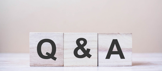 Q&A word with wooden cube block. FAQ( frequency asked questions), Answer, Question & Ask, Information, Communication and Brainstorming Concepts