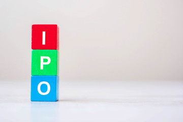 IPO (Initial Public Offering) word on wooden cube blocks, shares of a private corporation to the...