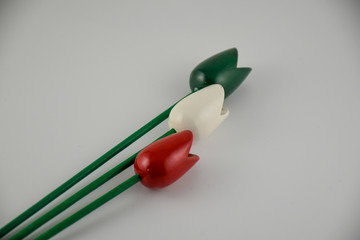 Fototapeta na wymiar Wooden tulips in the colors of the Italian national flag