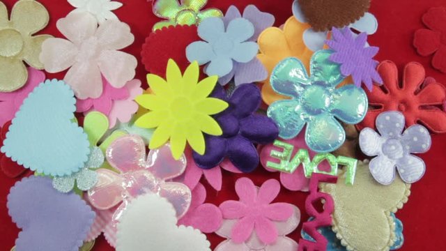 stop motion felt flowers on red felt 