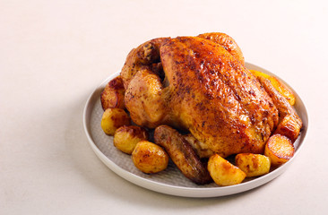 Roast whole chicken with potato