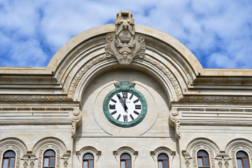 Fragment of beautiful historical building  with a clock on Fuzuli street. Azerbaijan, Baku city