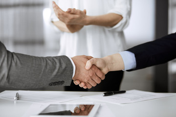 Business people shaking hands finishing contract signing, close-up. Business communication concept. Handshake and marketing