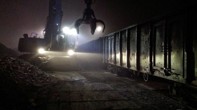 Mechanical Grabber In Junkyard At Night