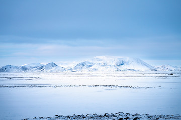 Snow covered Icelandic volcanic landscape in winter near Lake Myvatn, north east Iceland