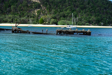 Aerial view of Tangalooma Island shipwrecks and national park in Moreton Bay region, Queensland Australia