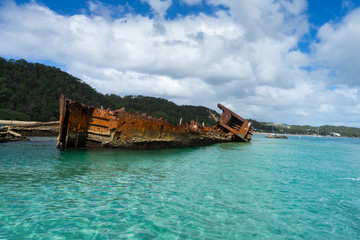 Aerial view of Tangalooma Island shipwrecks and national park in Moreton Bay region, Queensland Australia