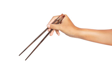 hand holding wooden chopsticks isolated on white background. clipping paths.
