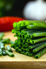 Allium schoenoprasum, popularly known as chives, chives or chives, in Portugal, is a plant originally from Europe. Close up, chopped on wooden board.