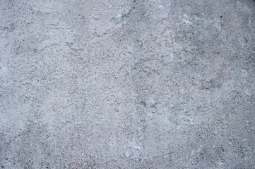 Grey concrete wall with a rough surface. Background