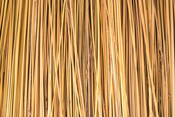 Close up of yellow striped straw texture as background.