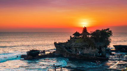 Breathtaking aerial view of of Tanah Lot Temple. Tanah Lot is a rock formation off the Indonesian island of Bali. It's home to the pilgrimage temple Pura Tanah Lot, a popular tourist and cultural icon © Konstantin