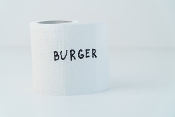 Toilet paper with text budrger. Concept of personal hygiene. Fast food Concept
