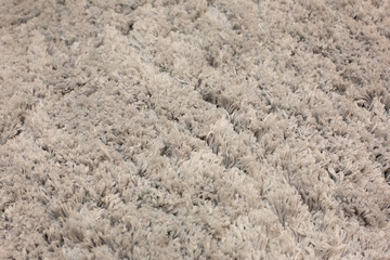 Handmade fluffy carpet texture, closeup. Wallpaper. 