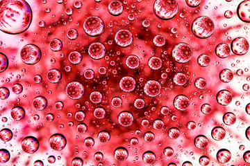 Image of a coronovirus through drops of water on glass