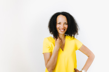 Portrait of cheerful black woman in yellow shirt