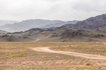 The road in the desert. Central Asia between the Russian Altai and Mongolia