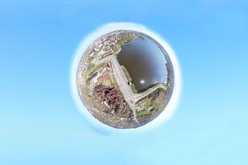 Transformation of the image of city street into a planet against bkue background. Little planet...