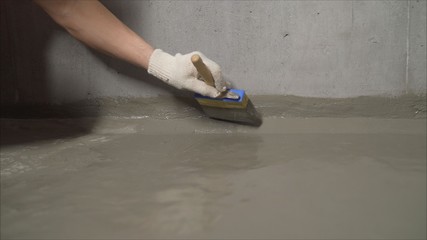 Waterproofing brush. Waterproofing coating. Waterproofing a building with a brush.