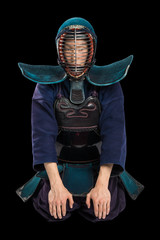 Portrait of man kendo fighter with shinai (bamboo sword). Shot in studio. Isolated with clipping...