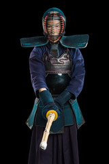 Portrait of man kendo fighter with shinai (bamboo sword). Shot in studio. Isolated with clipping...