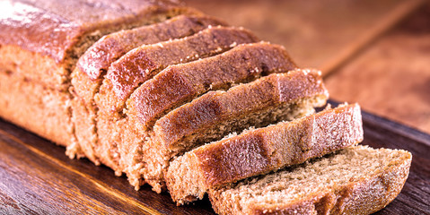 homemade banana cake with rustic wooden background.