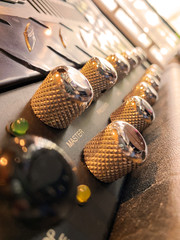 Close-up modern head power amplifier with black Silver knob and black control panel. clean and...