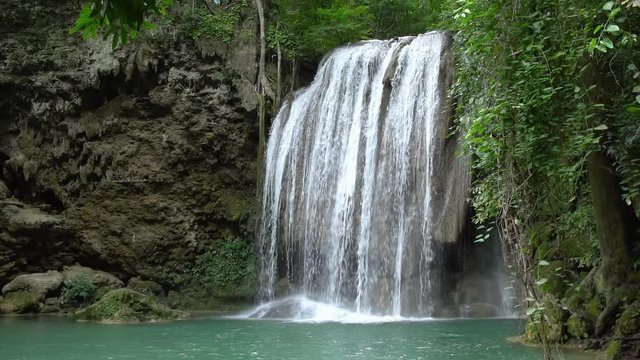 Erawan waterfall third level in National Park, famous tourist destination in Kanchanaburi, Thailand - slow motion