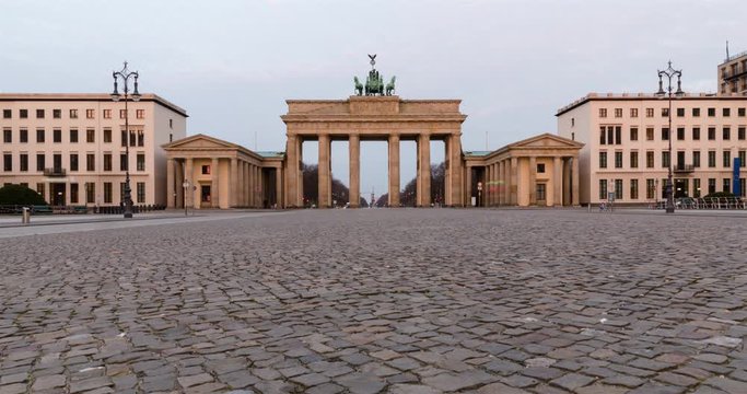 Night to day timelapse transition at Parise Platz Berlin with Brandenburger Tor and slider movement low angle view