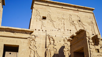 Beautfil Philae temple Egypt architecture hieroglyphic and column in  Aswan sunny blue sky