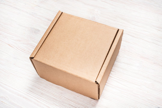 Brown Cardboard Box, Mock Up, On Wooden Background