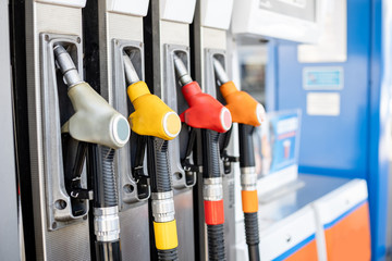 refueling pistols in a column at a gas station