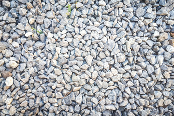 dark gravel pebbles stone texture. Gravel road background.
