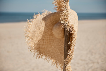 Straw hat on the beach © 4Media Creations