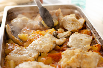 oven pan with fish cooked.