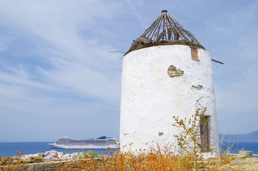 Famous Mykonos town windmills on hot summer day during Mediterranean cruise to the Greek Islands...